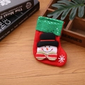Detail of a red Christmas stocking with green sequins and a 3D snowman on wooden background - Sequin Snowman Style / Small