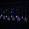 Detail of multi-color LED star curtain lights with large and small glowing pendants - Star Style / Multicolor