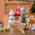 Handgefertigter Lebkuchenmann-Anhänger mit rot karierter Mütze für den Weihnachtsbaum - Roter Weihnachtsmützen-Stil