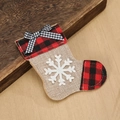 Detail of Christmas burlap cutlery holder with red plaid trim and a white snowflake patch - Christmas Sock