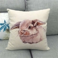 Close-up of a rustic linen cushion featuring a watercolor Easter bunny on a sofa - 45x45cm / Realistic Watercolor Rabbit Style (14)