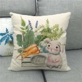 Detail view of Happy Easter linen pillowcase with rabbit and carrot prints on a sofa - 45x45cm / Hand-painted Bunny Carrot Plant Style (15)