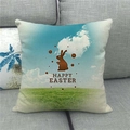 Close-up of Happy Easter linen pillowcase with bunny silhouette on a grey fabric sofa - 45x45cm / Blue Sky Grassland Rabbit Silhouette Style (19)