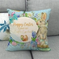 Funda de cojín de Pascua de lino con diseño de conejo en un sofá gris - Conejito de Pascua con Lunares Azules