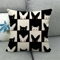 Detail of linen cushion cover featuring black and white checkered animal patterns on a sofa - Black White Grid Cat Rabbit Style (1)