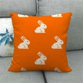 Close-up of linen pillowcase with white rabbit patterns on vibrant orange fabric - Orange Background White Rabbit Silhouette Style (14)