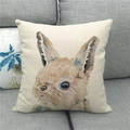 Close-up of Easter linen pillowcase with watercolor rabbit on a grey fabric sofa - Watercolor Ink Style Rabbit (8)