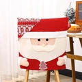 Detail of knitted Santa Claus chair cover with plush trim and festive tree patterns - Santa Claus