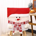 Close-up of snowman Christmas chair cover with red knit hat and plush snowflake scarf - Snowman