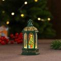 Detail of a green vintage Christmas lantern featuring a snowy tree and LED warm light - Christmas Tree