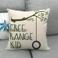 Close-up of linen cushion cover texture with tree branch and tire swing print - Free Range Kid (Style 11)