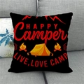 Detail of Happy Camper linen pillowcase on sofa featuring tent and bonfire graphics - Happy Camper Black (Style 14)