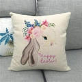 Detail of Happy Easter linen pillowcase showing bunny print and fabric texture on sofa - 45x45cm / Anthropomorphic Rabbit Avatar (Happy Easter)