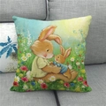 Easter decorative linen pillow cover with cute bunny illustration on a sofa - 45x45cm