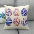Detail view showing linen texture and colorful Easter egg prints on the throw pillow cover - Blue Striped Berry Eggs (14)