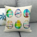 Detail of square Easter egg linen pillowcase with watercolor patterns on a grey sofa - Grid Watercolor Eggs (19)