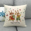 Detailed view of linen pillowcase with Happy Easter bunny print on a grey sofa - 45x45cm