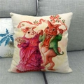 Detail of linen pillowcase featuring Victorian rabbits on a grey fabric sofa - Dressed Couple Rabbits (8)