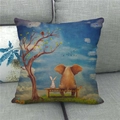 Detailed view of linen cushion cover showing elephant and rabbit illustration on a gray sofa - Elephant And Rabbit (9)