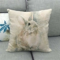 Close-up of linen Easter pillowcase with watercolor bunny pattern on a grey sofa - Fresh Watercolor Rabbit (11)