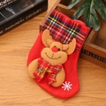 Christmas stocking with brown elk and red green plaid bow on warm wooden background - Scarf Reindeer / Small