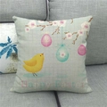 Close-up of Happy Easter linen pillowcase with bird and egg patterns on a grey sofa - Yellow Bird Pattern (5)