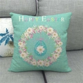 Detailed texture of Happy Easter linen pillowcase with mint green eggs on grey sofa - Mint Green Wreath Eggs Pattern (6)