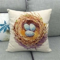 Detail of linen cushion cover with watercolor blue bird eggs on a gray sofa - Bird Nest Blue Spotted Eggs Pattern (8)