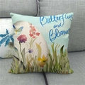 Linen pillow cover with watercolor blue butterflies and flowers on a grey sofa - Blue Butterfly and Floral Pattern (9)