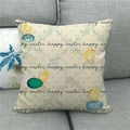 Close-up of linen Happy Easter pillowcase with colorful eggs and chicks on a gray sofa - Chick and Repeating Text Pattern (18)