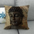 Close-up of linen pillow cover with Buddha stone carving print on a gray sofa - 45x45cm / Bronze Texture Buddha Head (7)