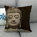 Close-up of linen pillowcase with Buddhist stone carving print on a gray sofa - 45x45cm / Old Wood Carving Buddha (12)