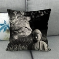 Linen pillowcase featuring a Zen cat and Buddha stone carving art print on a grey sofa - 45x45cm / Zen Cat and Buddha (16)