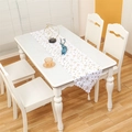 Close-up of white Christmas table runner with gold stars, wavy edges and tassels - Gold Five-pointed Star