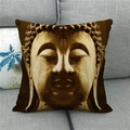 Detail of Buddha linen pillowcase showing golden head print on a modern grey fabric sofa - 18x18 Inch / Large Golden Brown Buddha (15)