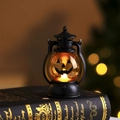 Detail of Halloween pumpkin lantern on vintage book with warm amber LED lighting effect - Smiling Pumpkin Style (Model A)