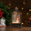 Close-up of vintage bronze Christmas lantern with snowman and glowing LED lights - Tree and Snowman Style