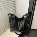 Large black glossy tote bag with dual shoulder straps for commute in minimalist setting - Black