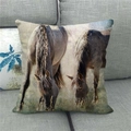 Detailed close-up of a linen pillowcase featuring horses grazing on a grey sofa - Grassland Grazing Style (5) / 45x45cm