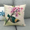 Linen cushion cover with floral and bird watercolor painting on a gray fabric sofa - Artistic Colorful Bird With Pink Flowers (6)