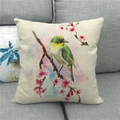 Linen pillow cover with watercolor flower and bird pattern on a grey sofa - Yellow Green Bird With Pink Flowers (16)