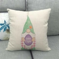 Detail of linen pillowcase with gnome and Happy Easter egg print on a grey sofa - Standard Square