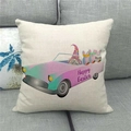 Linen Easter pillowcase detail showing Happy Easter print on a gray fabric sofa - Standard Square