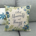 Linen pillowcase with blue floral wreath and Collect Moments not Things text on a sofa - Blue Flowers and Leaves (4)