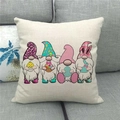 Easter Gnomes Happy Easter linen pillowcase with colorful egg and bunny graphics on a sofa - Standard Square