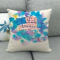 Linen US flag pillow cover with Proud to be American text on a grey fabric sofa - Watercolor Patriotic Quote (8) / 45x45cm