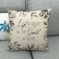 Detail of linen pillowcase with floral prints and Life is Short quote on gray sofa - Black Grey Floral Lettering (15)