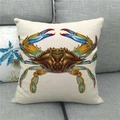 Detailed view of linen pillow cover featuring a watercolor crab print on a gray sofa - Brown Blue Gold Realistic Crab Print (14)