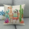 Close-up of linen cushion cover with colorful llama and cactus embroidery on a gray sofa - Bohemian Style Llama (15) / 18x18 Inch