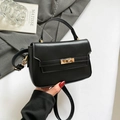 Elegante zwarte leren handtas met gouden metalen sluiting en handvat voor zakenvrouwen - Zwart